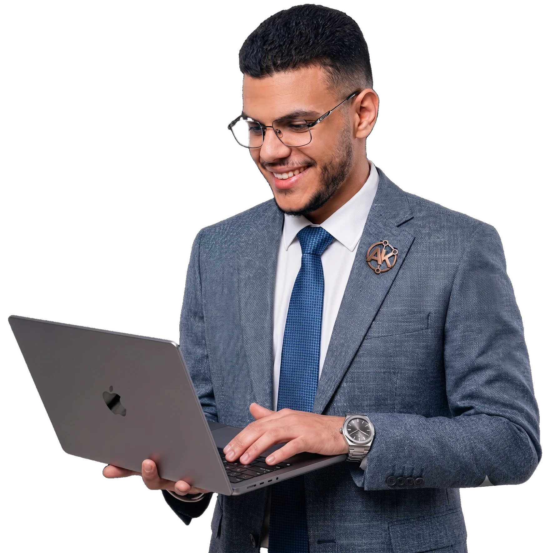 Abdullah Khaled smiling while working on an open laptop